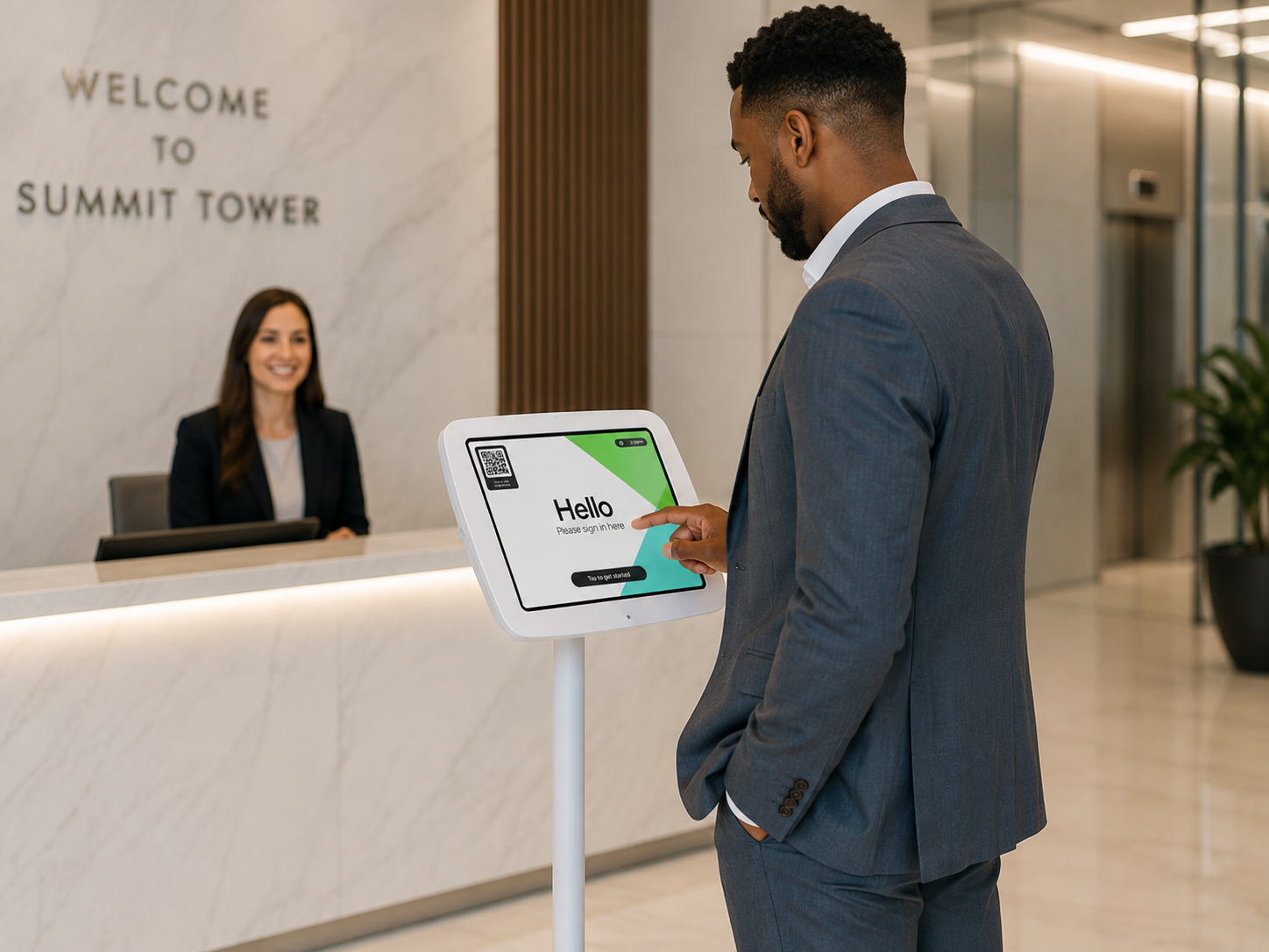 Visitor tapping to sign in on a Sign In App kiosk at a modern office reception desk, illustrating a visitor management system checking a guest in while a receptionist looks on.