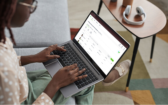 Woman checking Sign In App status on her laptop