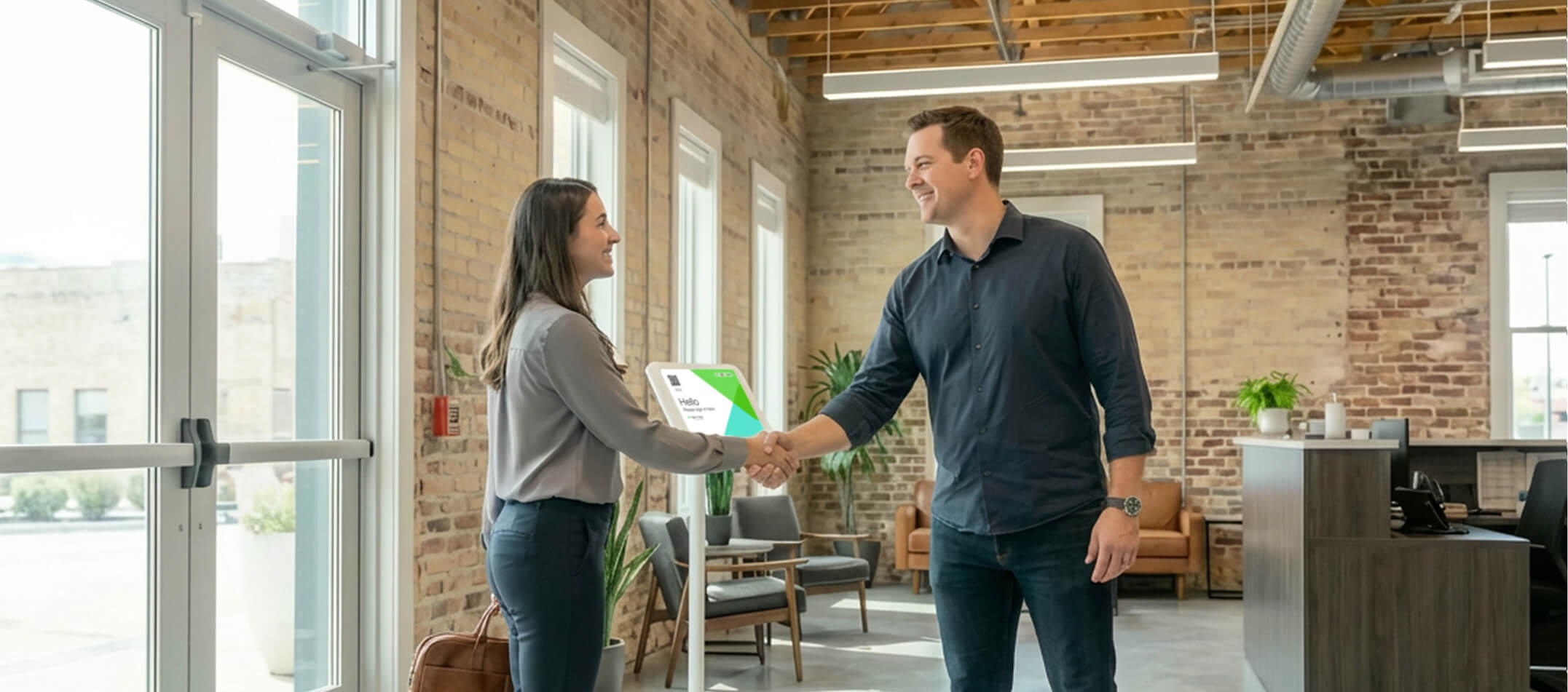 Two people are shaking hands in the reception of a small business